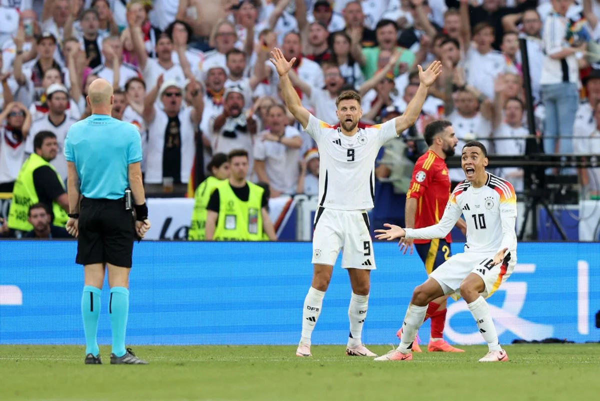 Germany players appeal to Taylor during the Euro 2024 quarter-final against Spain